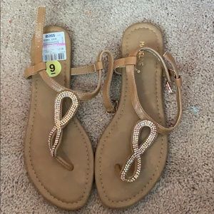 Tan size 9 sandals with minimum jewlz on it